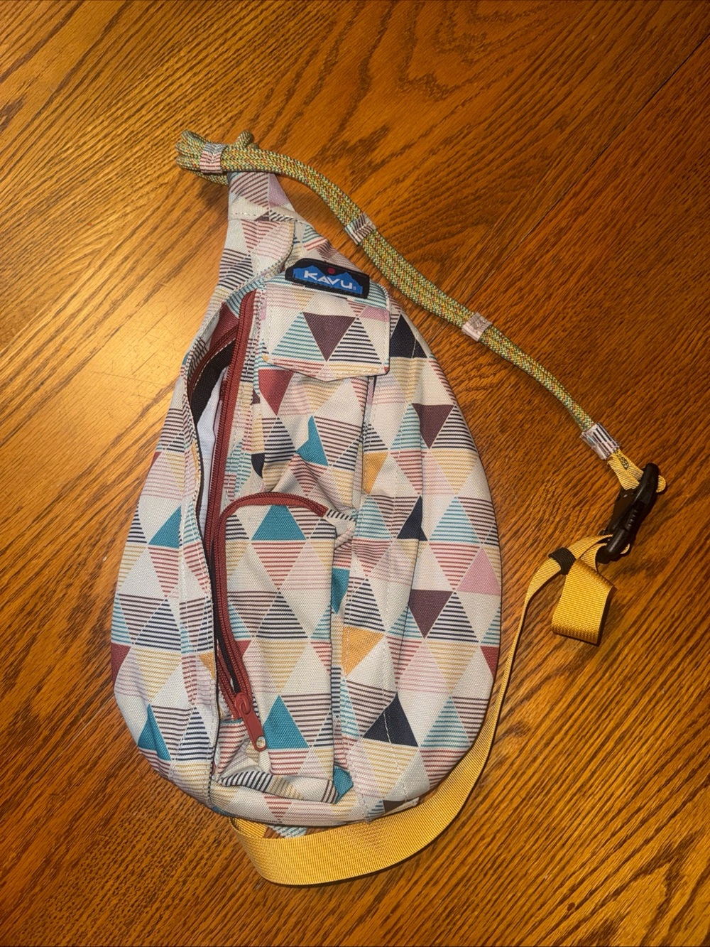 Kavu Triangular Print Crossbody Sling Bag in Teal, Pink, Yellow, Brown